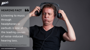 Hearing Protection blog teaching effects of loud music from Macks Ear plugs with guy ripping off headphones because music is playing too loud