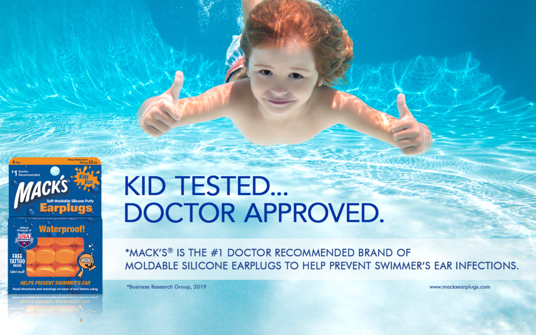 young kid swimming under water with macks kids sized waterproof silicone ear plugs