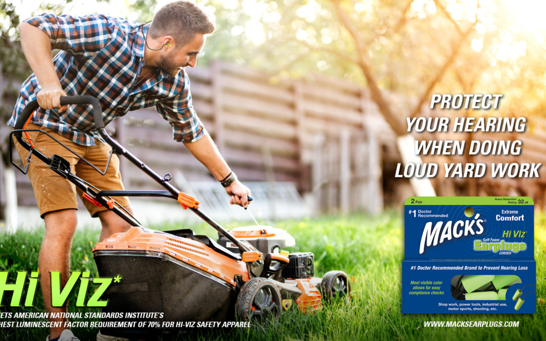 Man protecting his ears when doing loud yard work with Mack's Hi Viz corded Earplugs