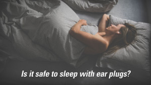 title says "is it safe to sleep with ear plugs?" with middle aged blonde woman sleeping with macks pillow soft moldable silicone ear plugs in