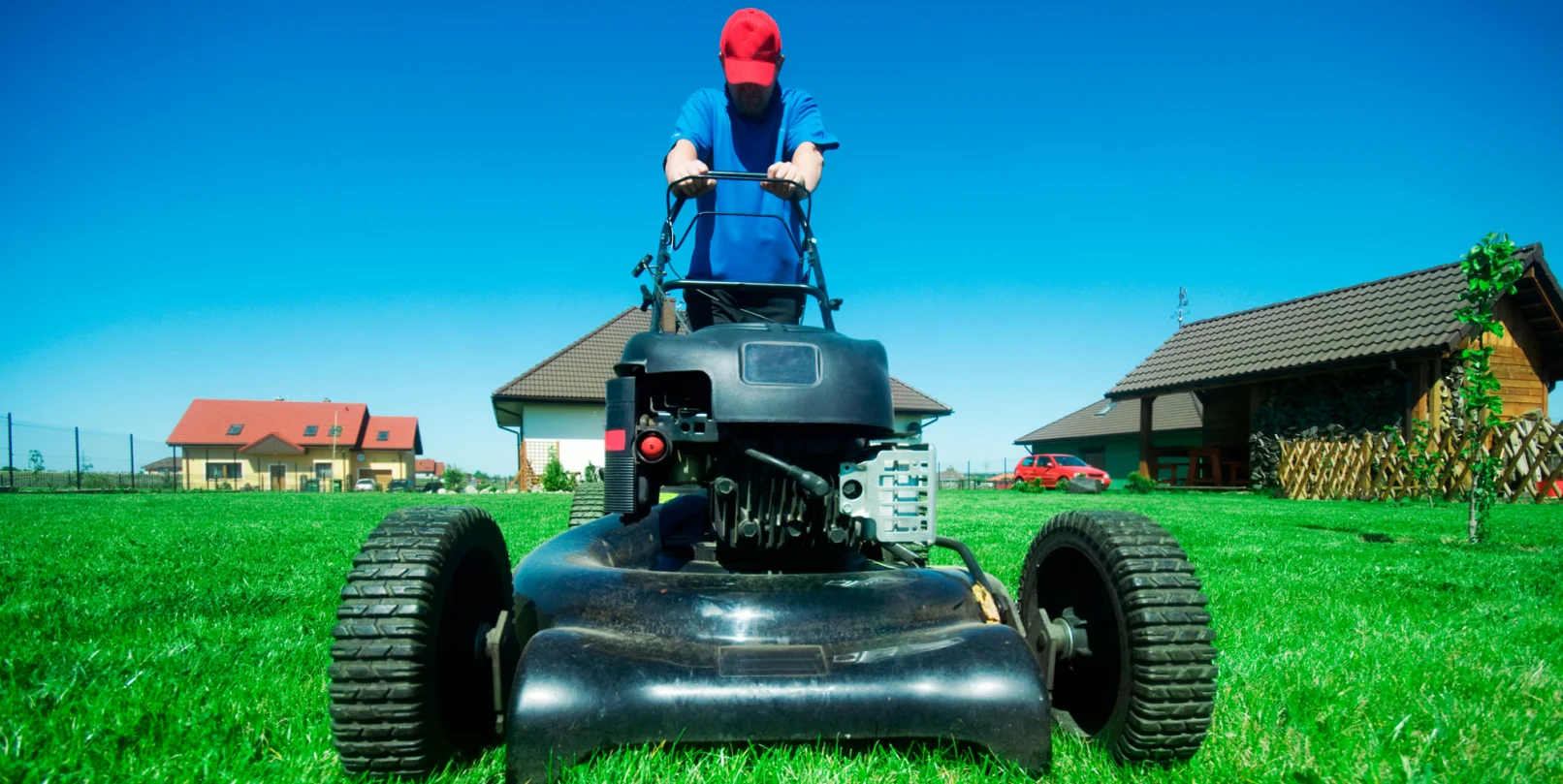 a man mowing his lawn outdoors